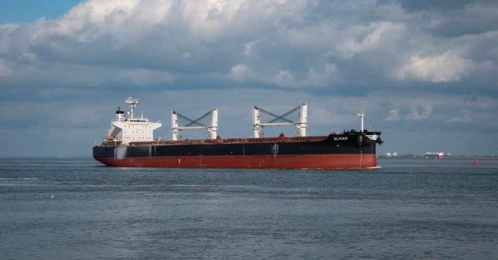 Bulk carrier navigating the North Sea under a cloudy sky near Netherlands.